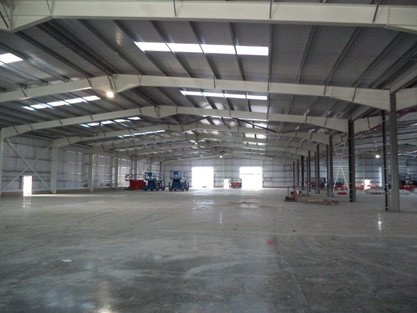 British Army fleet hub warehouse with hydraulic scissor lifts in the background