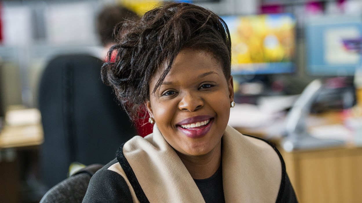 A smiling woman in an office