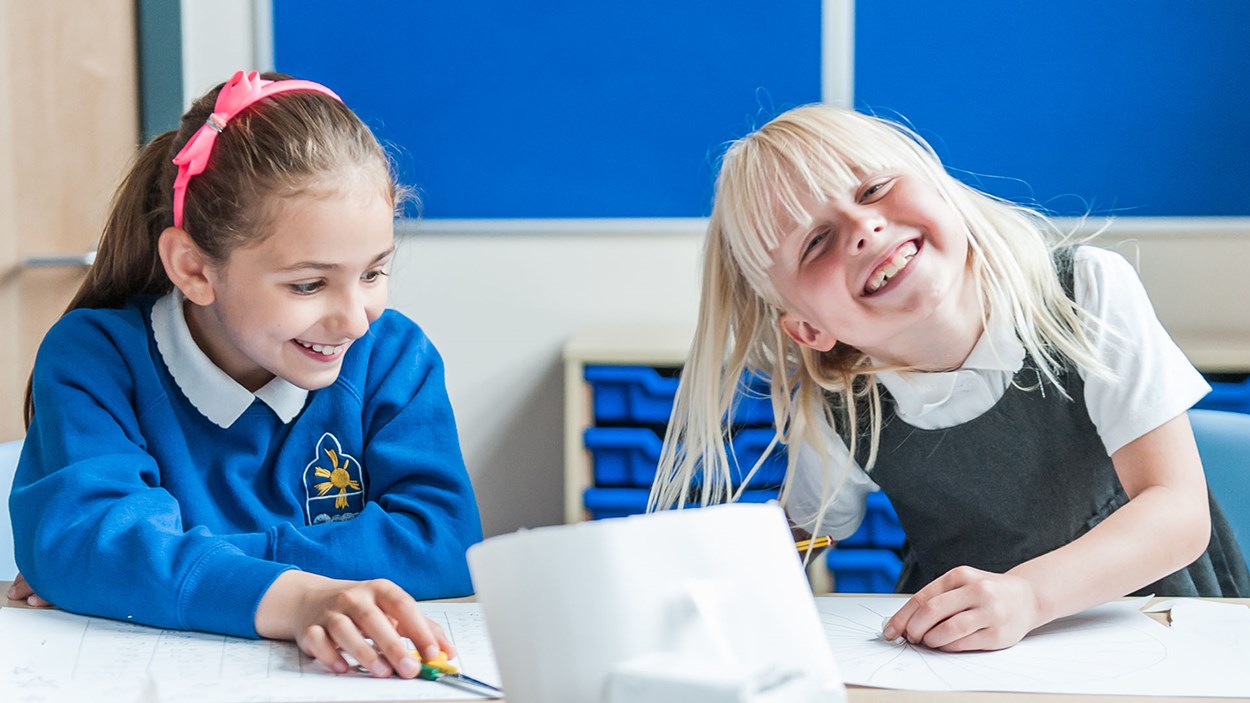 Two primary school girls in a classroom