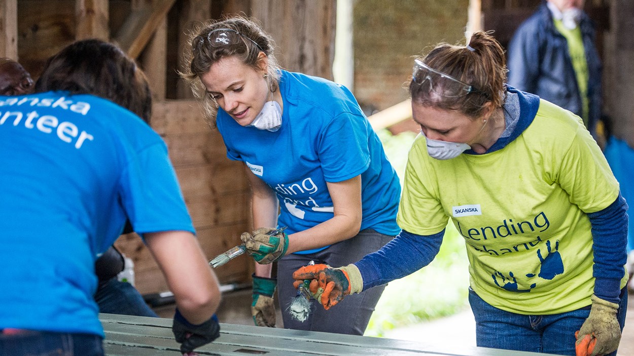 Skanska volunteers painting as part of  a community project