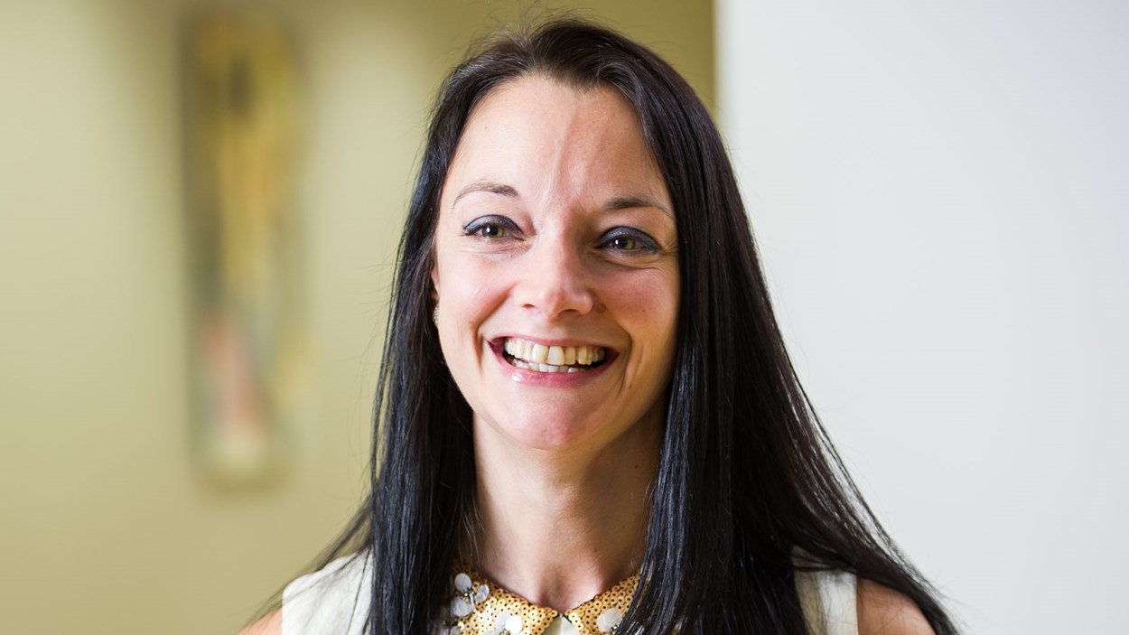 A smiling woman in an office