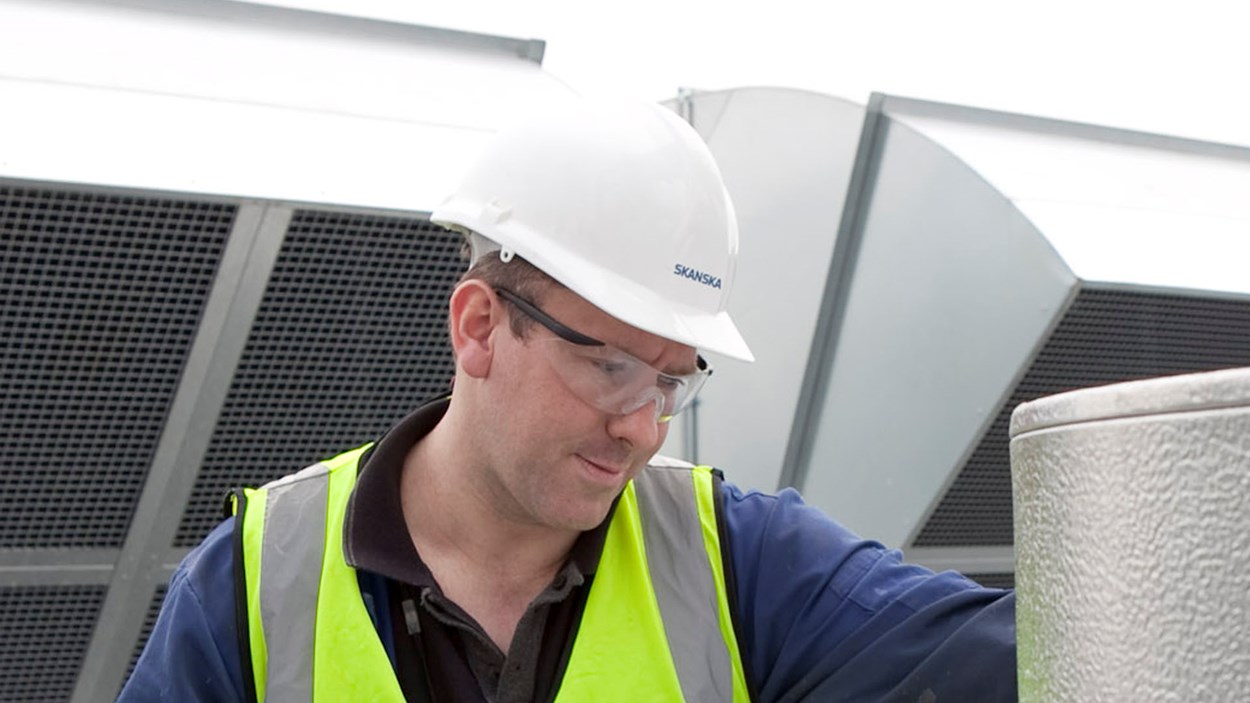 A Skanska person on site carrying out part of a mechanical and electrical fit out